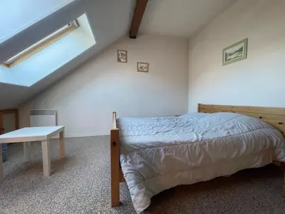 a bedroom with a bed and a skylight at Studio duplex lumineux au centre de Samoëns avec parking - FR-1-624-58 in Samoëns
