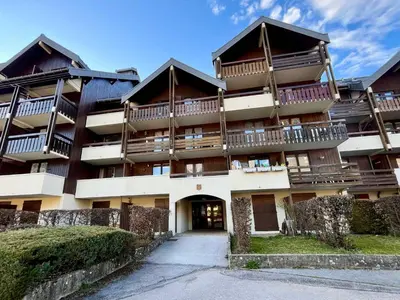 a large building with balconies on the side of it at Studio duplex lumineux au centre de Samoëns avec parking - FR-1-624-58 in Samoëns