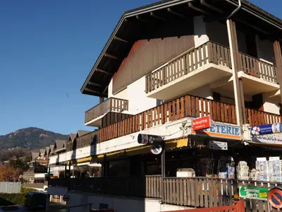 a building with balconies on the side of it at Appartement T2 avec balcon au centre de Samoëns - FR-1-624-44 in Samoëns