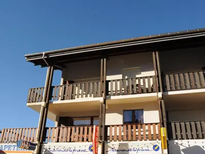 a building with balconies on the side of it at Appartement T2 avec balcon au centre de Samoëns - FR-1-624-44 in Samoëns