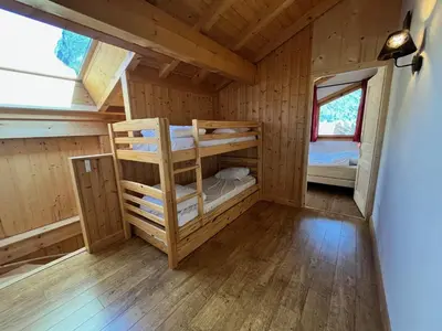 a room with bunk beds in a cabin at Appartement T3 confortable proche centre avec balcon et parking - FR-1-624-42 in Samoëns