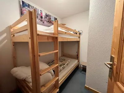 a bunk bed room with two bunk beds in it at Appartement T2 avec Balcon et Parking à Samoëns - FR-1-624-37 in Samoëns