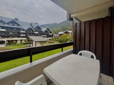 a bedroom with a bed and a large window at Studio cosy au cœur du village avec animaux admis et parking - FR-1-624-57 in Samoëns
