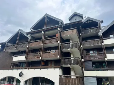 a building with balconies on the side of it at Studio cosy au cœur du village avec animaux admis et parking - FR-1-624-57 in Samoëns