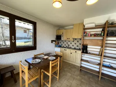 a kitchen with a table and chairs in a room at Résidence Les Granges De Colomb - Granges de Colomb B106 MAE-5322 in Combloux