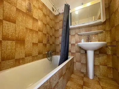 a bathroom with a sink and a bath tub and a sink at Duplex familial cœur de village, animaux admis - FR-1-624-1 in Samoëns