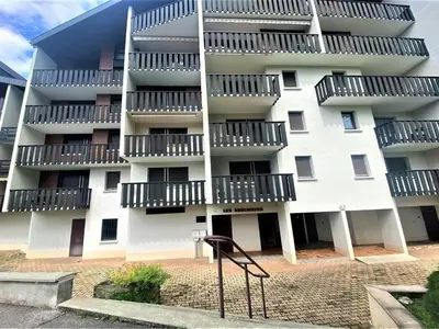 an apartment building with balconies on the side of it at Studio lumineux au centre de Samoëns, vue sur Le Criou - FR-1-624-52 in Samoëns