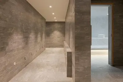 a hallway with a stone wall at RockyPop Flaine Hotel & Spa in Flaine