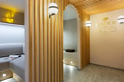 a room with a bed and a sign on the wall at RockyPop Flaine Hotel & Spa in Flaine
