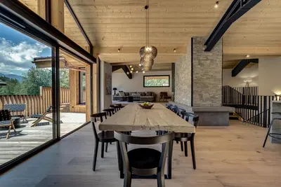an open dining room with a table and chairs at Chalet Breitalps in Chamonix-Mont-Blanc
