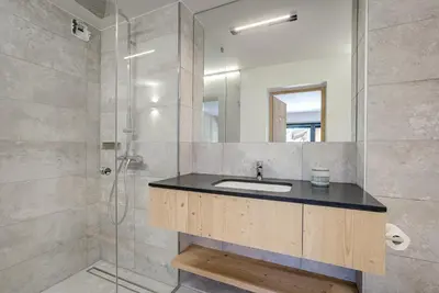 a bathroom with a sink and a shower at Chalet Breitalps in Chamonix-Mont-Blanc