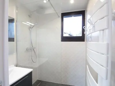 a white bathroom with a shower and a sink at Duplex 2P/4 avec Balcon, WIFI et Parking Les Carroz - FR-1-572-15 in Les Carroz d'Araches