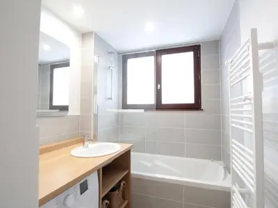 a bathroom with a sink and a tub and a toilet at Charme au centre d'Arâches : 2 pièces + coin montagne, 4/5 pers, proche pistes et commerces - FR-1-572-154 in Les Carroz d'Araches