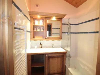a bathroom with a sink and a shower and a tub at 4 pièces spacieux bien équipé avec Wi-Fi et parking, au pied du ski bus - FR-1-572-241 in Les Carroz d'Araches