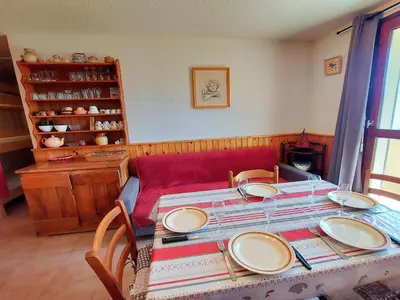 a bed with two pillows on it in a room at Appartement skis aux pieds, balcon, parking privé - FR-1-624-15 in Samoëns