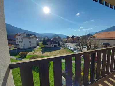 a dining room table and chairs with a table and a table at Studio cosy au centre de Samoëns avec animaux acceptés et parking - FR-1-624-70 in Samoëns