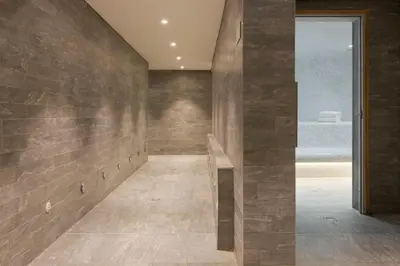 a hallway with a stone wall at RockyPop Flaine Appartements & Spa in Flaine