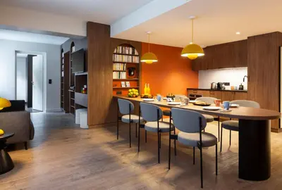 a kitchen and dining room with a table and chairs at RockyPop Flaine Appartements & Spa in Flaine