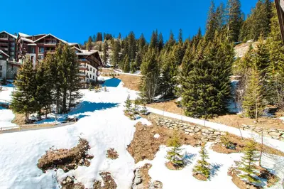 an aerial view of a resort in the snow at Cosy, modern 2-bed with fireplace & beautiful views in Flaine