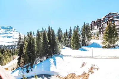 a view of a resort in the snow at Charming 6th-floor 2-bedroom apartment with fireplace in Flaine