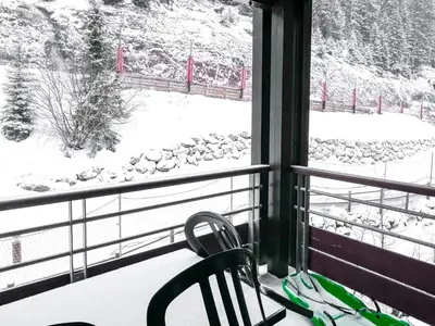 a view of a snow covered field from a window at Large one-bedroom apartment, wheelchair adapted, Les Terrasses d'Eos in Flaine