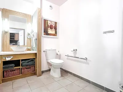 a bathroom with a toilet and a sink at Large one-bedroom apartment, wheelchair adapted, Les Terrasses d'Eos in Flaine