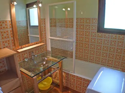 a bathroom with a glass sink and a shower at T2 calme à Samoëns - 4 pers, animaux admis - FR-1-629-70 in Samoëns