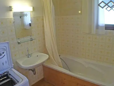 a bathroom with a sink and a toilet and a tub and a sink at Duplex 4 pièces avec balcon et Wifi à Samoëns pour 8 pers - FR-1-629-3 in Samoëns
