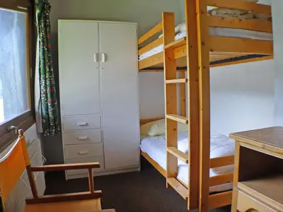 a dorm room with bunk beds and a desk at Duplex 4 pièces avec balcon et Wifi à Samoëns pour 8 pers - FR-1-629-3 in Samoëns