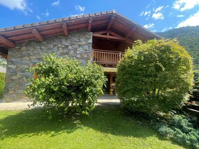 a log cabin with two trees in front of it at Chalet au centre de Samoëns avec jardin et cheminée - FR-1-624-17 in Samoëns