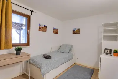 a small room with a chair and a window at Chalet Grand Balcon in Les Houches