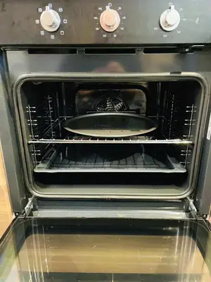 an open oven with a pan inside of it at Chalet Grand Balcon in Les Houches