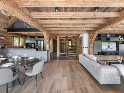 a living room with a couch and a table at Chalet Luxe 12 Pers. Face aux Pistes avec Skiroom, Garage, Salle de Sport et Services Inclus - FR-1-569-19 in Demi-Quartier
