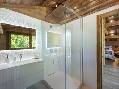 a bathroom with a shower and a sink at Chalet Luxe 12 Pers. Face aux Pistes avec Skiroom, Garage, Salle de Sport et Services Inclus - FR-1-569-19 in Demi-Quartier