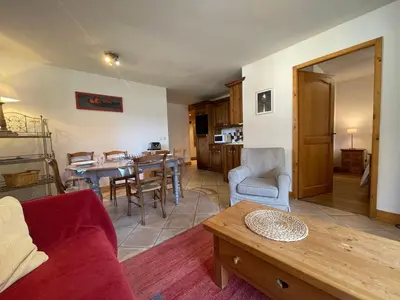 a living room with a couch and a table at Appartement T3 au centre de Samoëns avec balcon, WIFI et parking - FR-1-624-23 in Samoëns