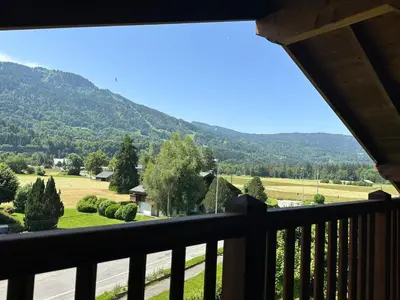 a view from the balcony of a house at Appartement duplex spacieux avec piscine et WiFi à Samoëns - FR-1-624-9 in Samoëns