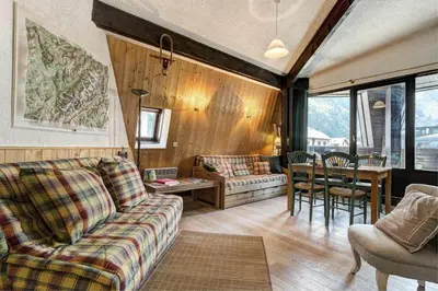 a living room with a couch and a table at Apartment Lachenal - Alpes Travel - Alpes Travel - Central Chamonix - sleeps 2-4 in Chamonix-Mont-Blanc