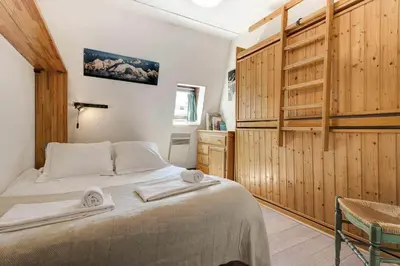 a bedroom with a bed with two towels on it at Apartment Lachenal - Alpes Travel - Alpes Travel - Central Chamonix - sleeps 2-4 in Chamonix-Mont-Blanc