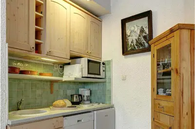 a kitchen with a sink and a microwave at Apartment Lachenal - Alpes Travel - Alpes Travel - Central Chamonix - sleeps 2-4 in Chamonix-Mont-Blanc