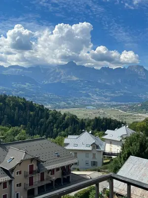 a view of mountains and houses in a town at onlysaintg - Apartment Bernadette Spacious 4 bedrooms Great views, 120 m2 Only 500m from the centre and ski lift GREAT YEAR ROUND in Saint-Gervais-les-Bains
