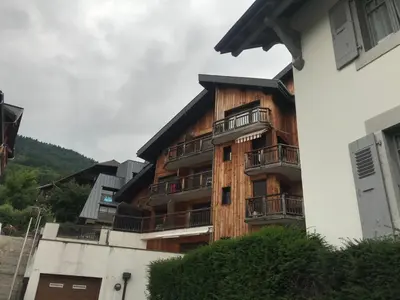 a building with balconies on the side of it at Studio pour 2 près du centre de Samoëns - FR-1-629-77 in Samoëns