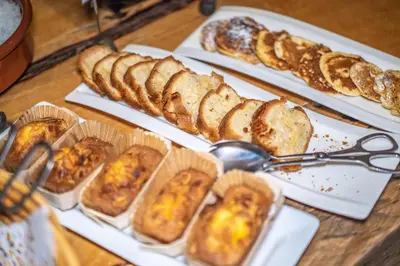 a table topped with different types of bread and pastries at Best Western Plus Pays du Mont Blanc in Sallanches