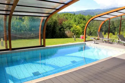 a swimming pool in a house with a view at Best Western Plus Pays du Mont Blanc in Sallanches