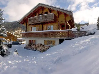 a log cabin with snow on the ground at Chalet 3 chambres calme, poêle à bois, proche piste et village, 6/8 pers, garage et parking - FR-1-572-243 in Les Carroz d'Araches