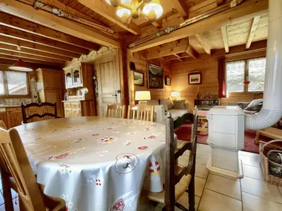a dining room with a table in a room at Chalet 3 chambres calme, poêle à bois, proche piste et village, 6/8 pers, garage et parking - FR-1-572-243 in Les Carroz d'Araches