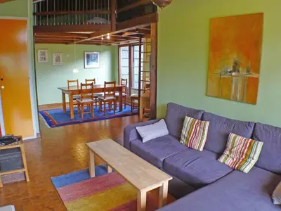 a living room with a couch and a table at Charmant appartement 2 pièces mezzanine, animaux admis, Samoëns - FR-1-629-53 in Samoëns