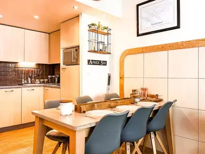 a dining room with a table and chairs in a kitchen at Large 2-Bedroom Apartment, Centre of Flaine Foret in Flaine