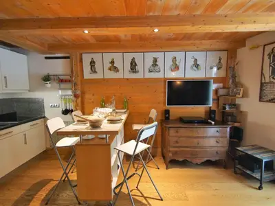 a living room with a couch and a table at Apartment Les Jardins de l'Astoria by Interhome in Chamonix-Mont-Blanc