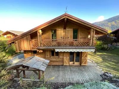 a log cabin with snow on the roof at Chalet massif du Mont Blanc St Gervais Megeve in Saint-Gervais-les-Bains