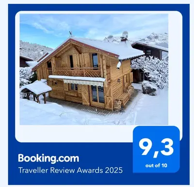 a wooden cabin with snow on the roof at Chalet massif du Mont Blanc St Gervais Megeve in Saint-Gervais-les-Bains